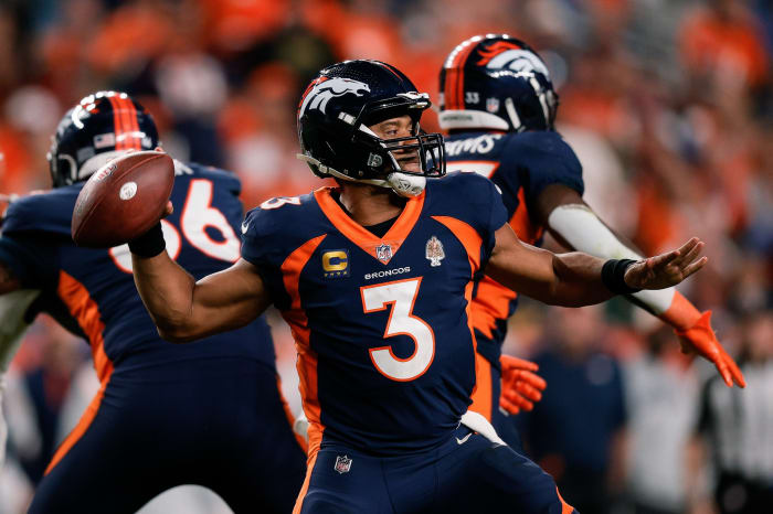 Denver Broncos quarterback Russell Wilson (3) attempts a throw in the fourth quarter against the San Francisco 49ers at Empower Field at Mile High.